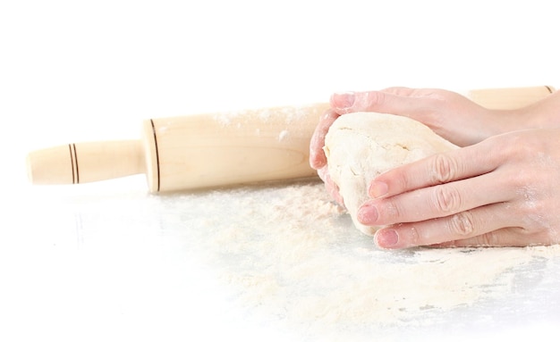 Hands preparing dough